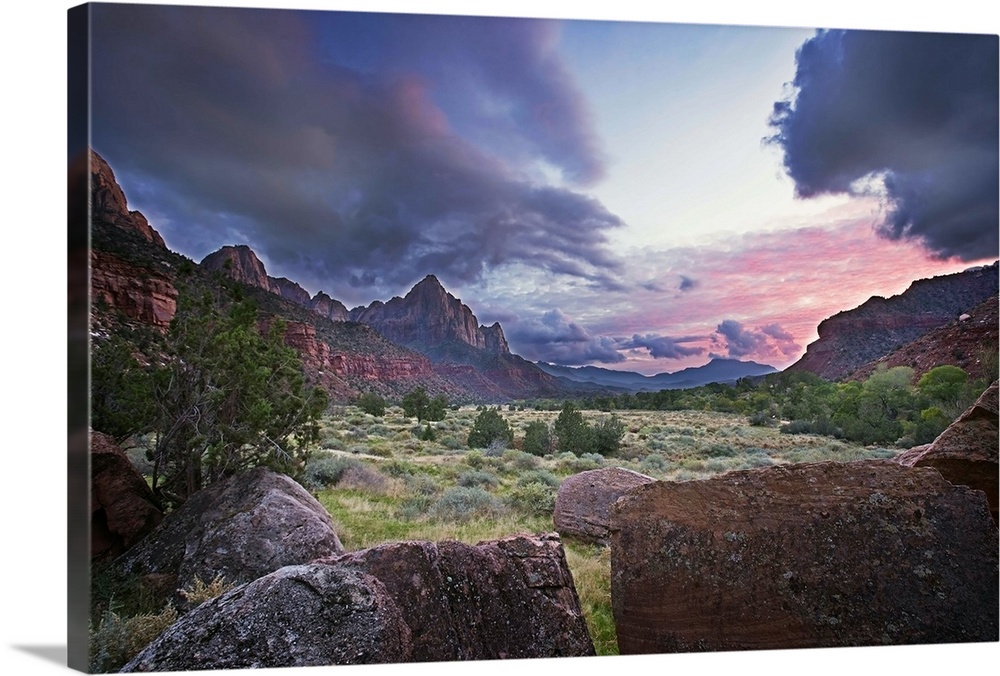 The sun sets with red clouds in Zion National Park
