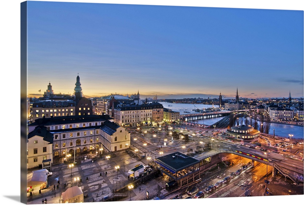 This is a view over Slussen which is the main traffic central of the island of Sdermalm. The green and red subway lines sp...