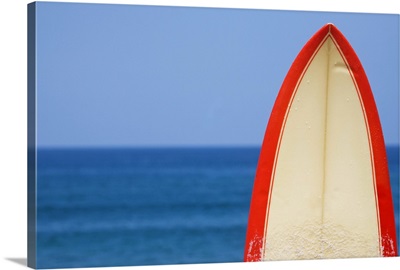 Surfboard in front of sea on Las Canteras beach in Las Palmas de Gran Canaria.