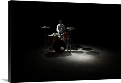 Teenage boy playing drums