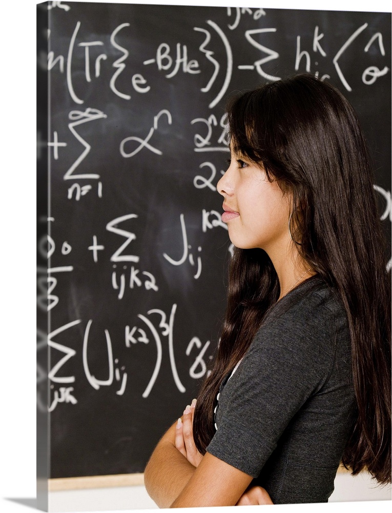Teenage girl student at blackboard with math equations