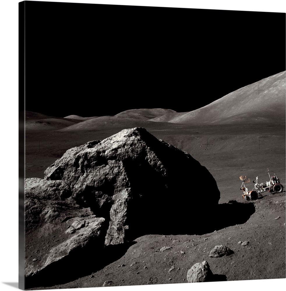 The Apollo 17 lunar rover sits on a slope near a large rock in the Moon's Taurus-Littrow Valley. | Location: Taurus-Littro...