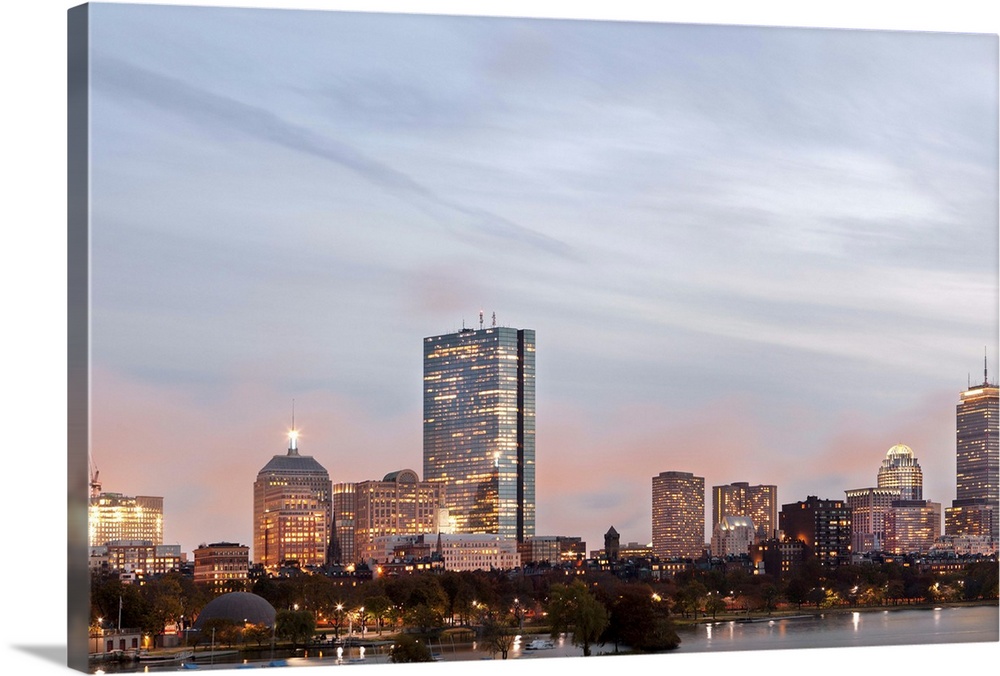 The city of Boston from Charles River at dusk
