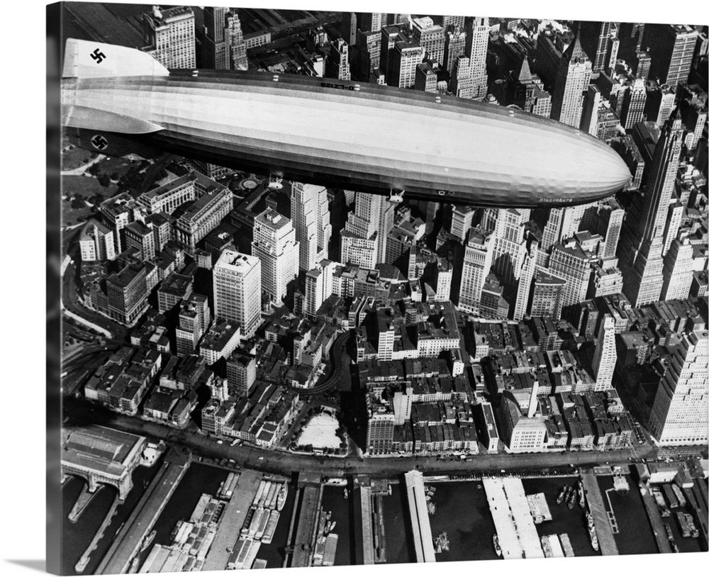 The German airship, the Hindenburg, above Manhattan, New York in 1936, on its way to its berth at Lakehurst , New Jersey, ...