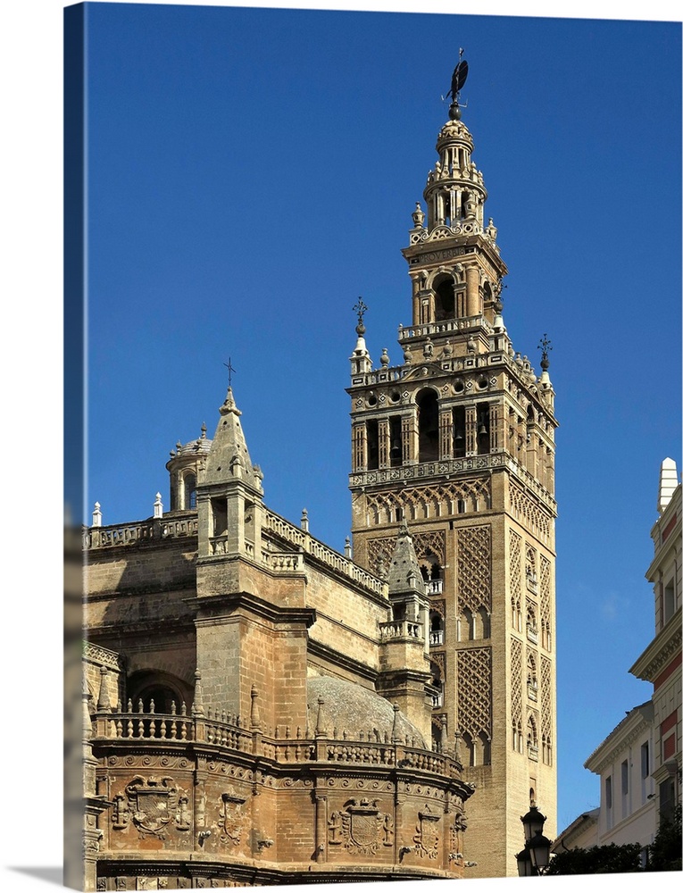 The Giralda  is a former minaret that was converted to a bell tower for the Cathedral of Seville in Seville, wich was regi...