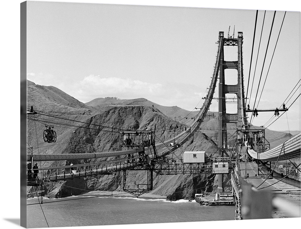 Looking from San Francisco toward the marine shore at the construction of the Golden Gate Bridge.
