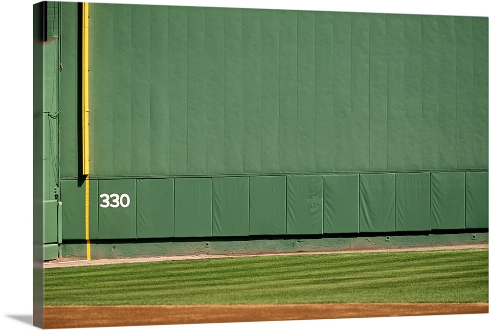 This wall is known as 'the Green Monster.'Foul line and distance marker visible.