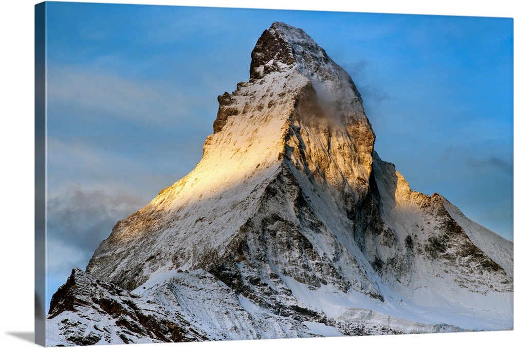 The peak of the Matterhorn at sunrise.