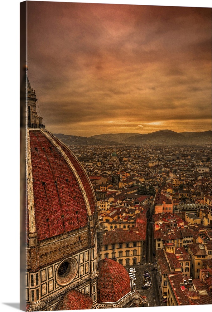 Tall canvas photo of vintage Italian buildings with rolling mountains in the distance.