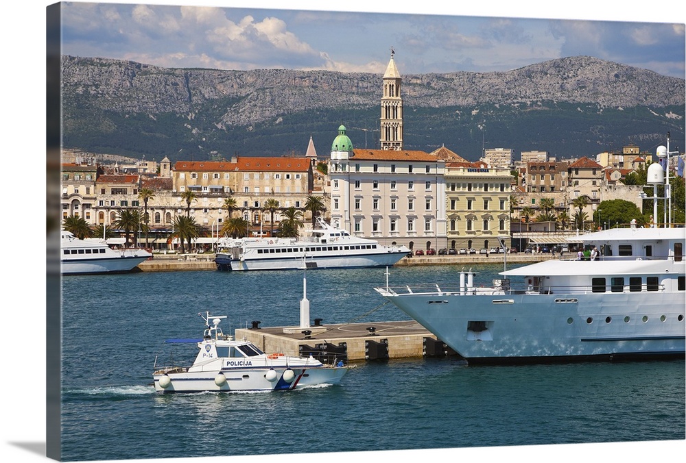 Looking along the harbourfront to the Riva and the campanile of St Domnius cathedral in Diocletian Palace, Split, Croatia.
