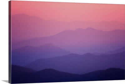The Sunset turns the sky pink over the mountains