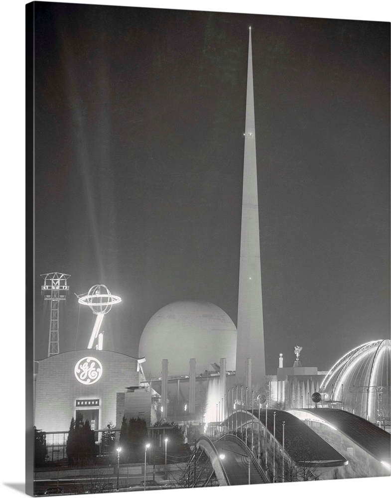 The wonders of modern illumination dispel the dark shades of night at the New York World's Fair. The Trylon and Perisphere...