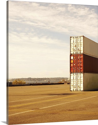 Three cargo containers in dock