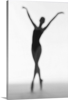 toned silhouette of a young woman performing ballet
