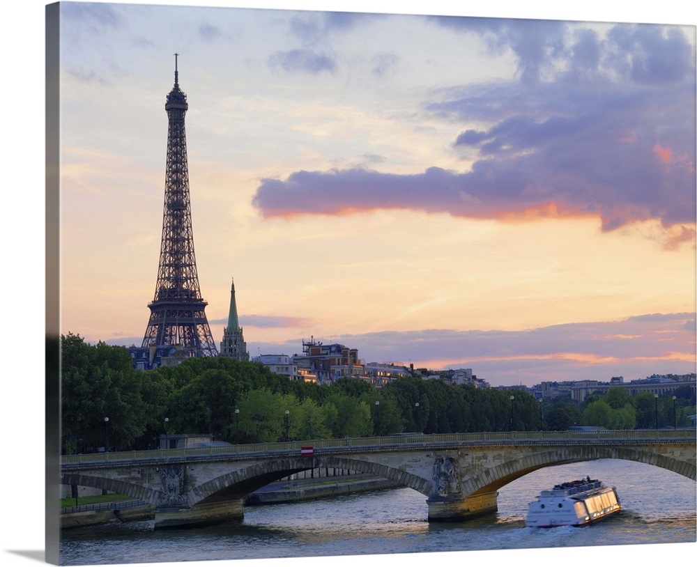 Tour boat on the River Seine near the Eiffel Tower at dusk Wall Art ...