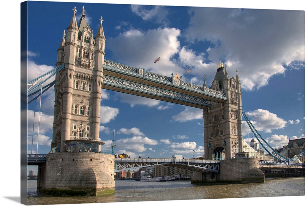 Tower Bridge is combined bascule and suspension bridge in London, England, over River Thames.