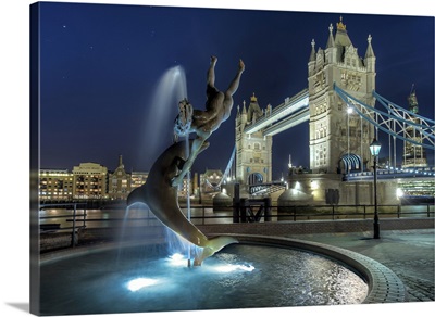 Tower Bridge with  dolphin fountain in London.