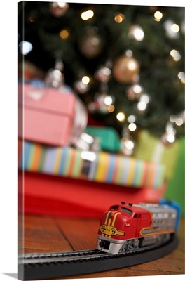 Toy Train Running Beneath Christmas Tree