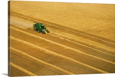 Tractor harvesting grain