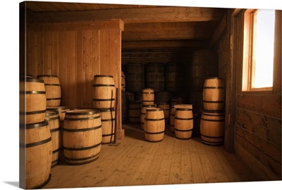 Traditional barrels in a wooden storage room