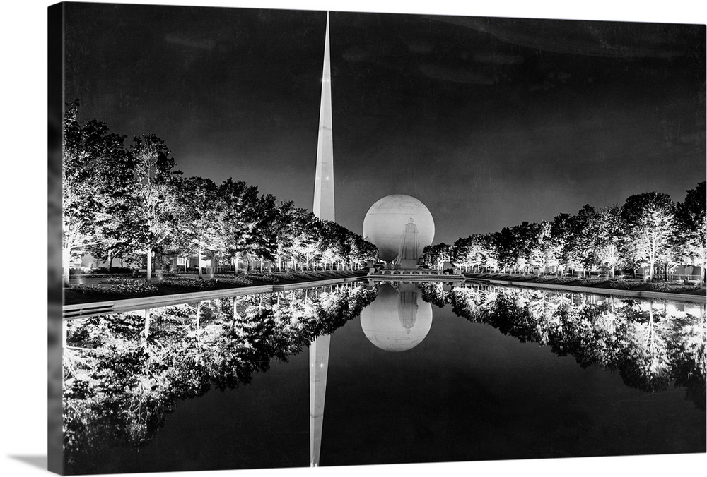 Trees illuminated with General Electric E-3 Novalux floodlights are reflected on the Constitutional Mall reflection pool a...