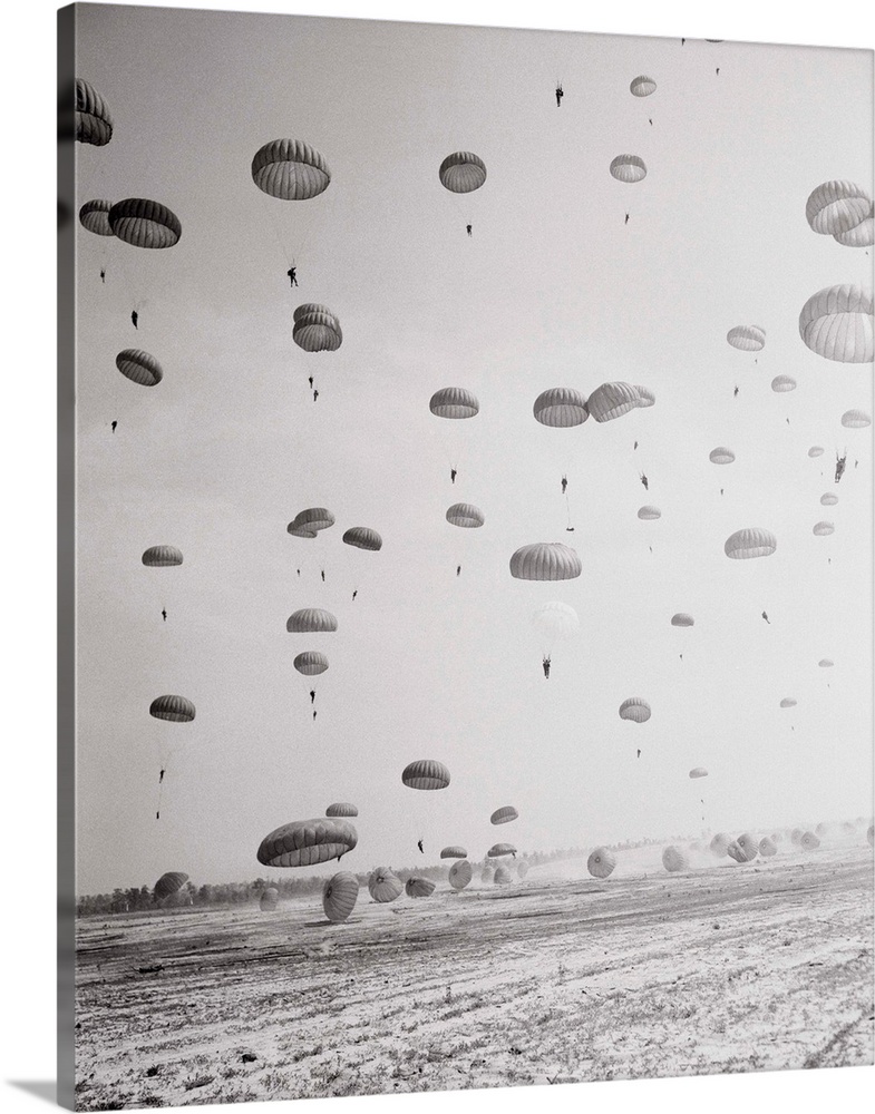 Troops of the 82nd airborne division and the XV1L1 airborne corps put on this mass parachute jump for top Defense Departme...