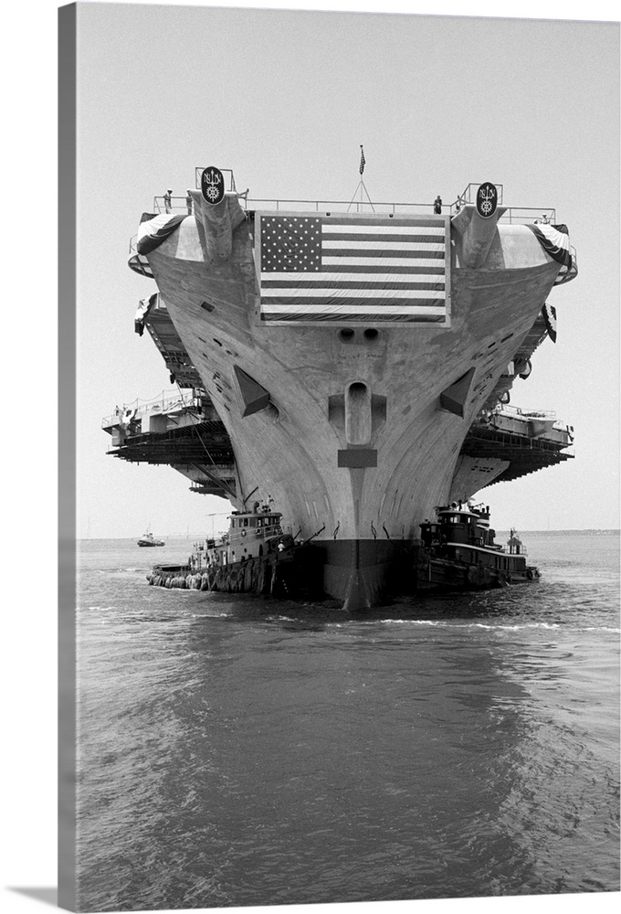5/30/1967 - Newport News, VA - The mighty $200-million aircraft carrier John F. Kennedy, sporting a large American flag, i...