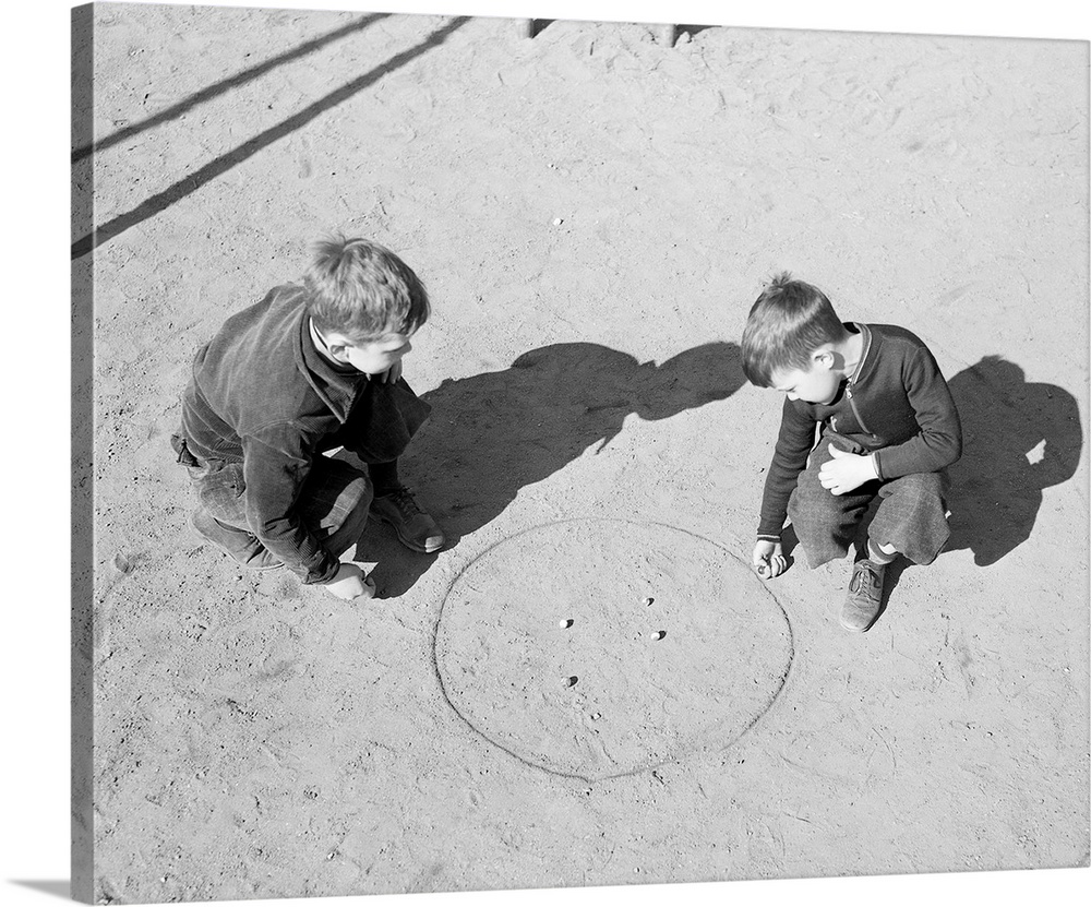 Bet you a quarter... Photo shows little boys actively involved in a game of marbles. Models: Charles Harold Burdick and Do...