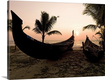 Two canoes on the beach at the Arabian Sea, Kerala, India