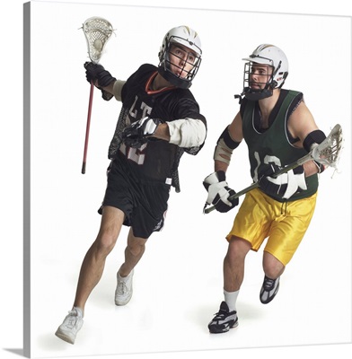 Two male lacrosse players from opposite teams running