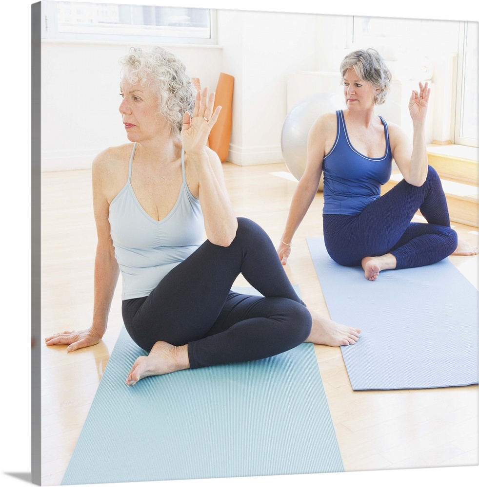 USA, New Jersey, Jersey City, Two senior women practicing yoga