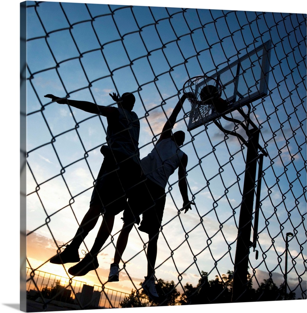 USA, Utah, Salt Lake City, two young men playing street basketball, low angle view