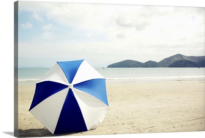 Umbrella on sand, Brazil.