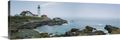 USA, Maine, Portland, Remote coastline with lighthouse