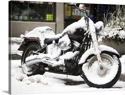 USA, New York City, motorbike covered with snow