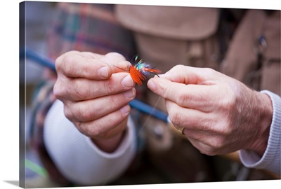 USA, Washington, Vancouver, Close-up of fisherman's hands tying fly onto line