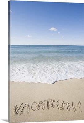 'Vacation' written on sandy beach, Nantucket Island, Massachusetts