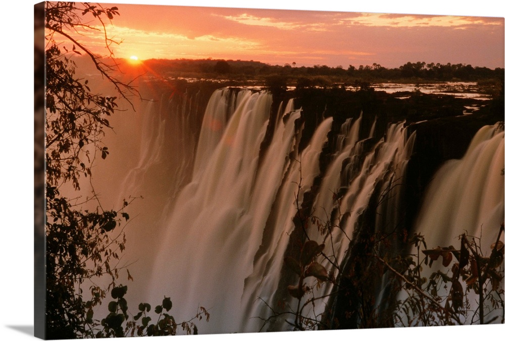 Victoria Falls with sun on horizon, Victoria Falls, Zimbabwe