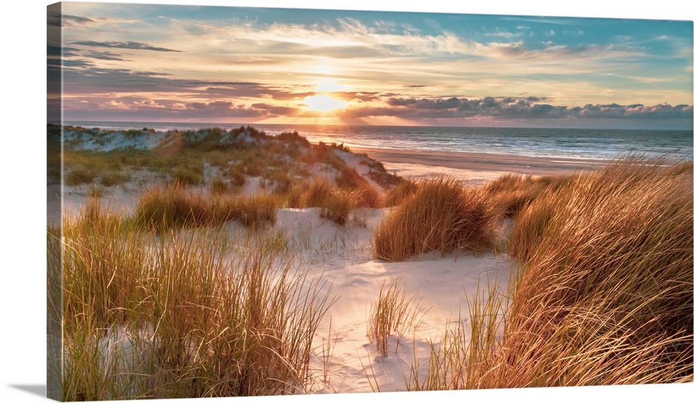 Sunset View from dune top over North Sea from the island of Ameland, Friesland, Netherlands.