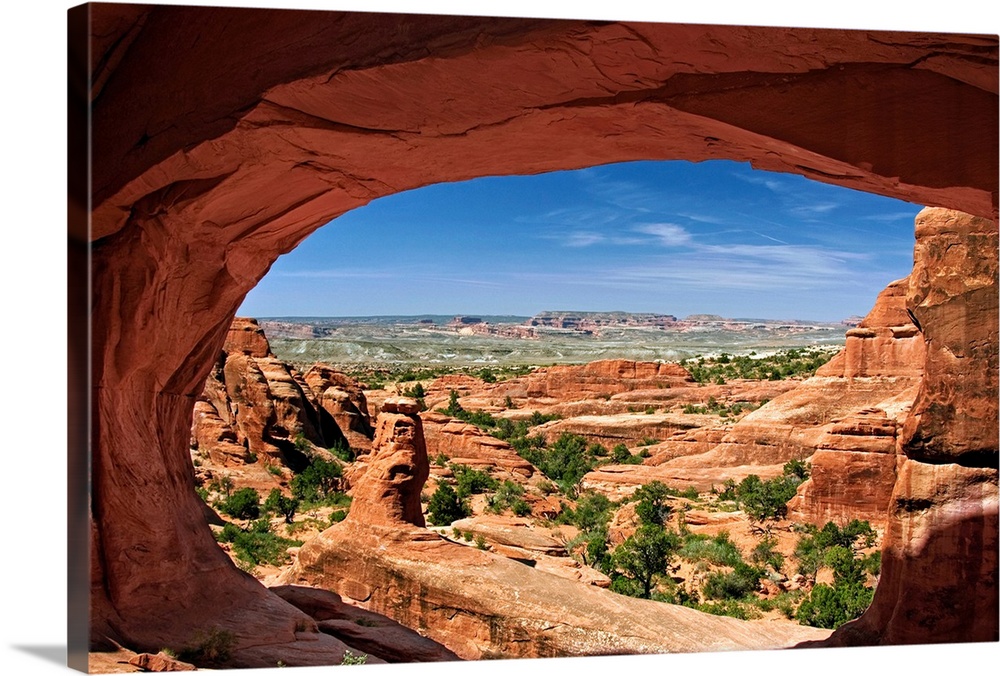 View of Arches National Park looking through Tower Arch.