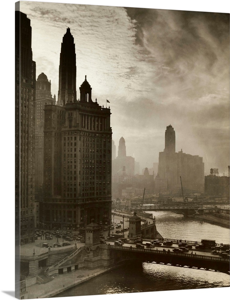 An interesting study made in the late afternoon showing an unusual cloud formation above the Chicago River district; the n...