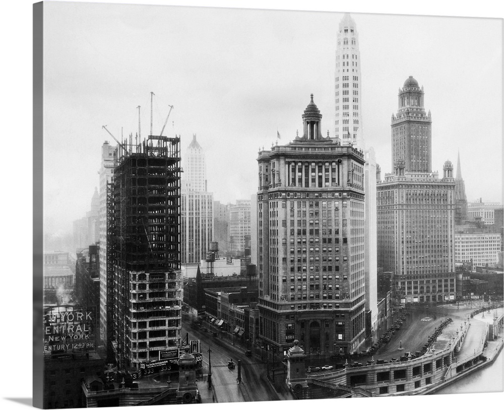 This remarkable photograph shows a view looking south from the Tribune Building over the Link Bridge and the buildings lof...