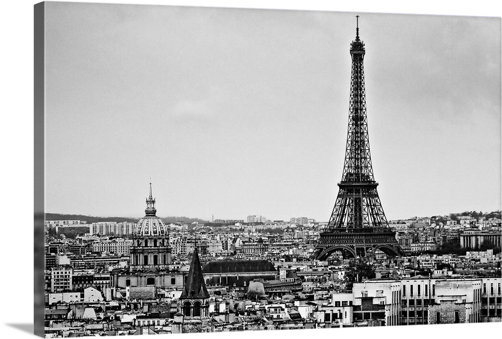 Landscape photograph on a giant wall hanging of the Eiffel Tower, surrounded by the city of Paris, France.