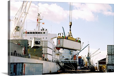 View of cranes loading cargo on a ship