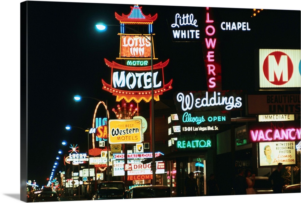 This is a general view of a Wedding Chapel sign in foreground, as well as motels, restaurants, etc., along Las Vegas boule...