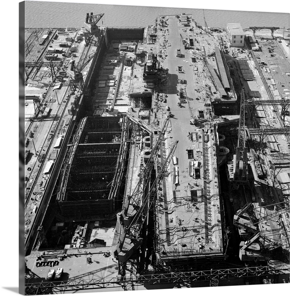 Last-minute work is rushed on the U.S. Navy's super-aircraft carrier, the U.S.S. Forrestal. The longest combat ship in the...