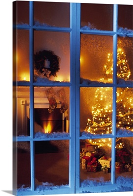 View through window of home decorated for Christmas
