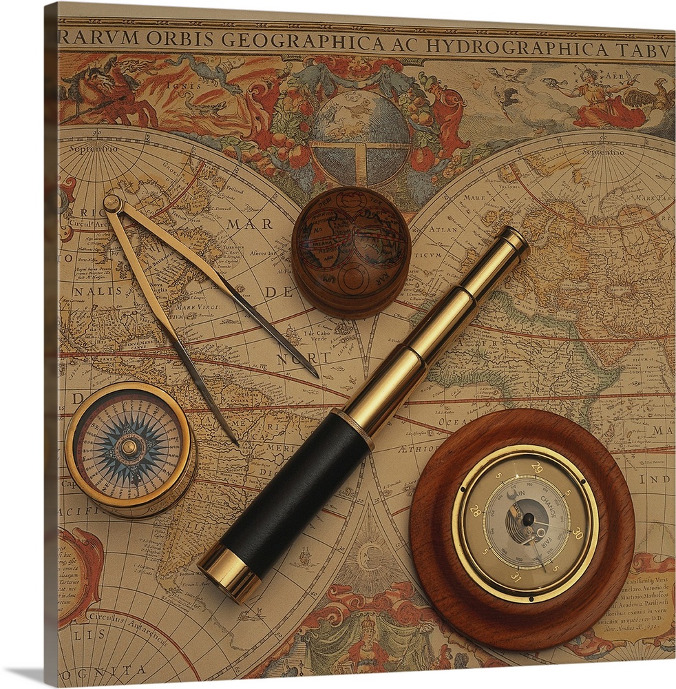 Square, oversized photograph of an antique world map with vintage navigation tools such as a compass, divider and telescop...