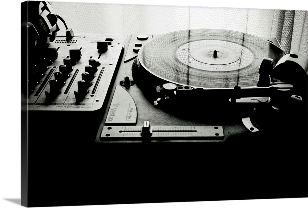 Vinyl record spinning on record player.