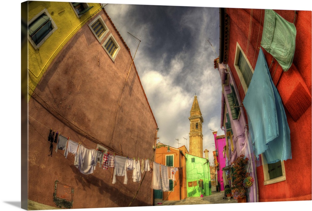 Washday in Burano - a small island close to Venice.  Taken with a 16mm fisheye lens.The houses are famous for their bright...